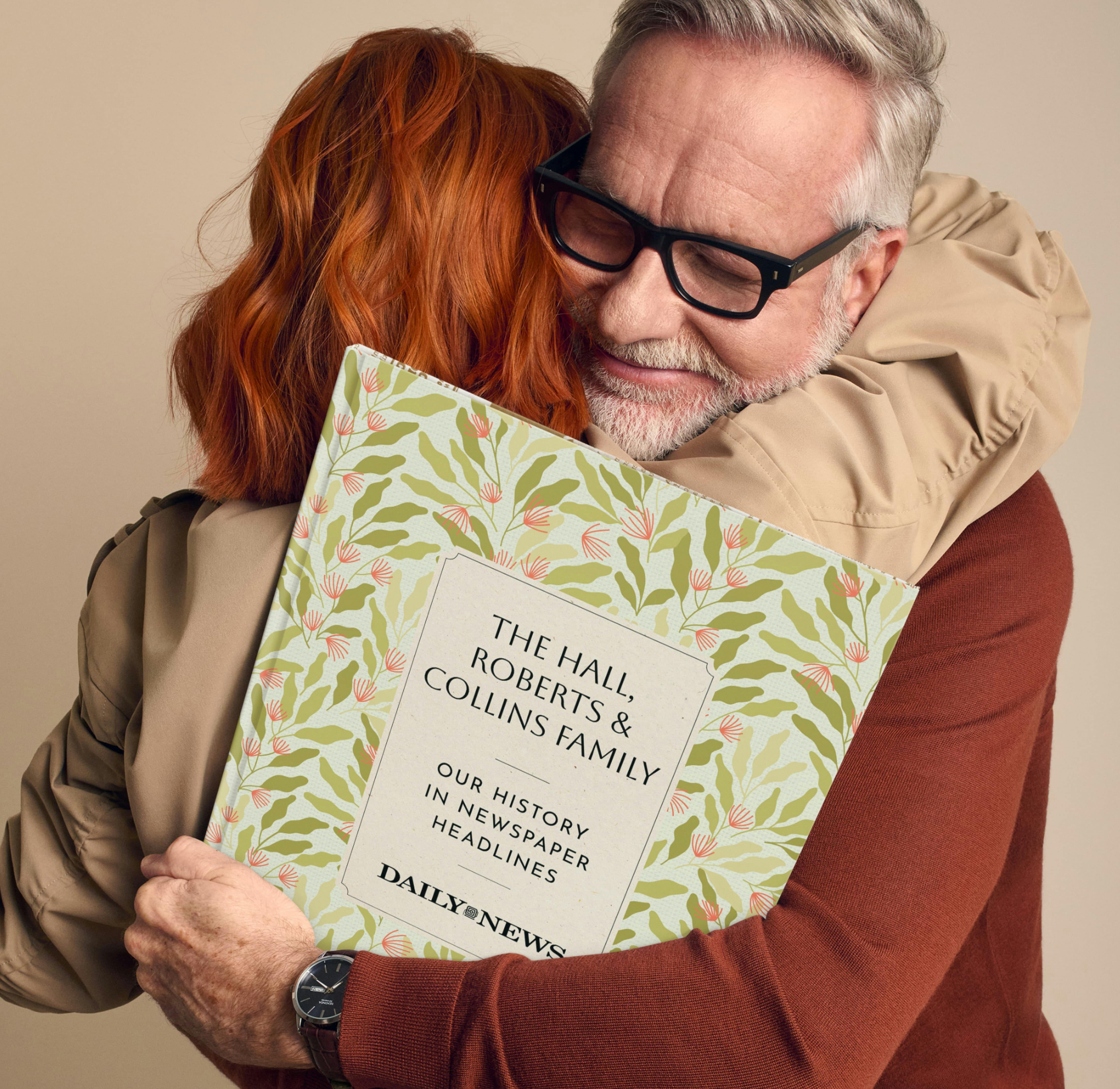 Father hold a book and hugging his adult child