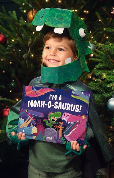 Child holding Name o Saurus