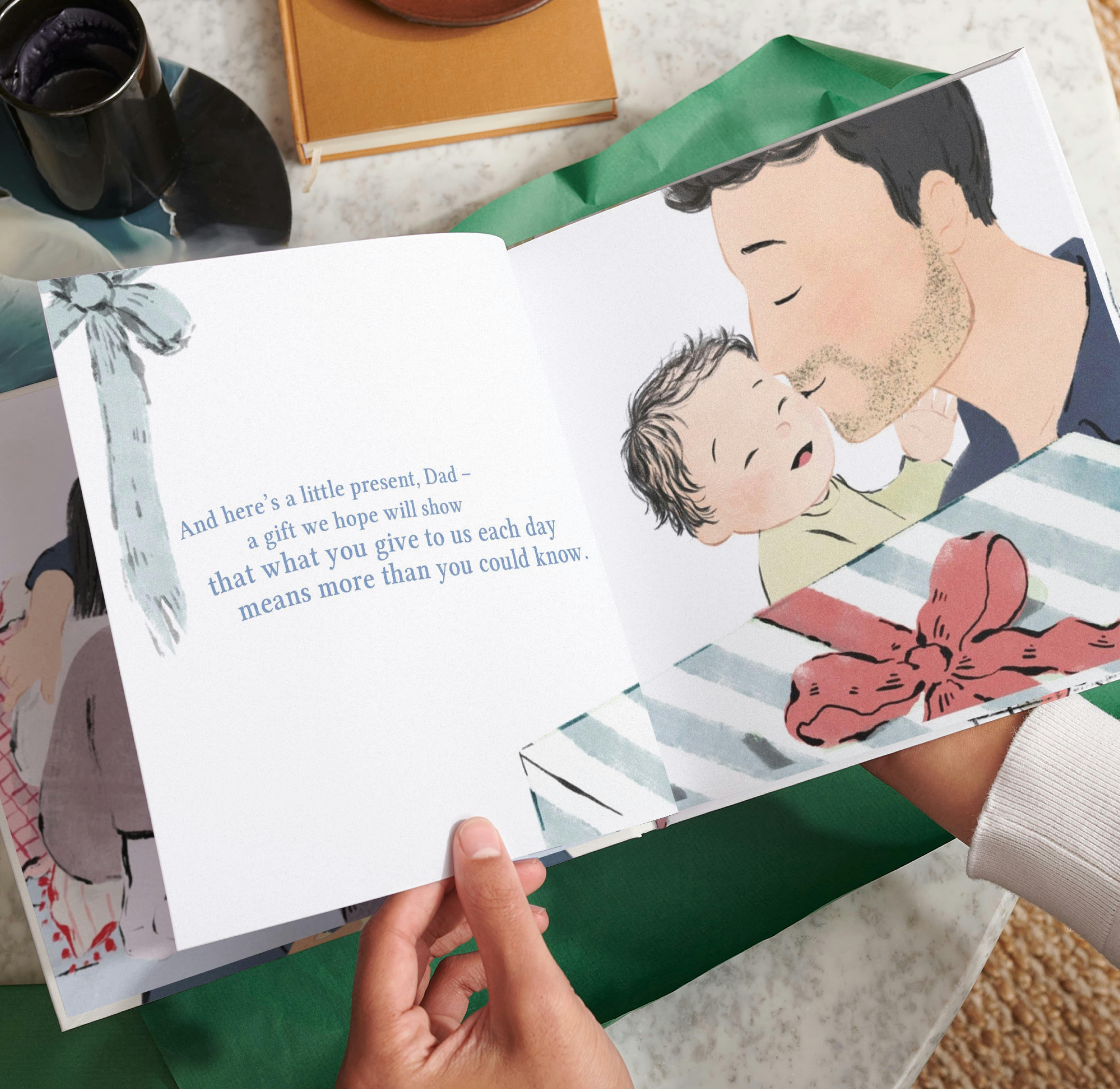 Two hands holding the open personalised book