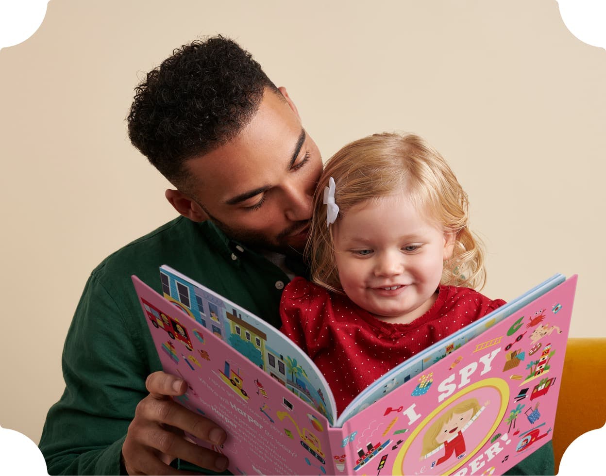 A child and father reading the personalised book