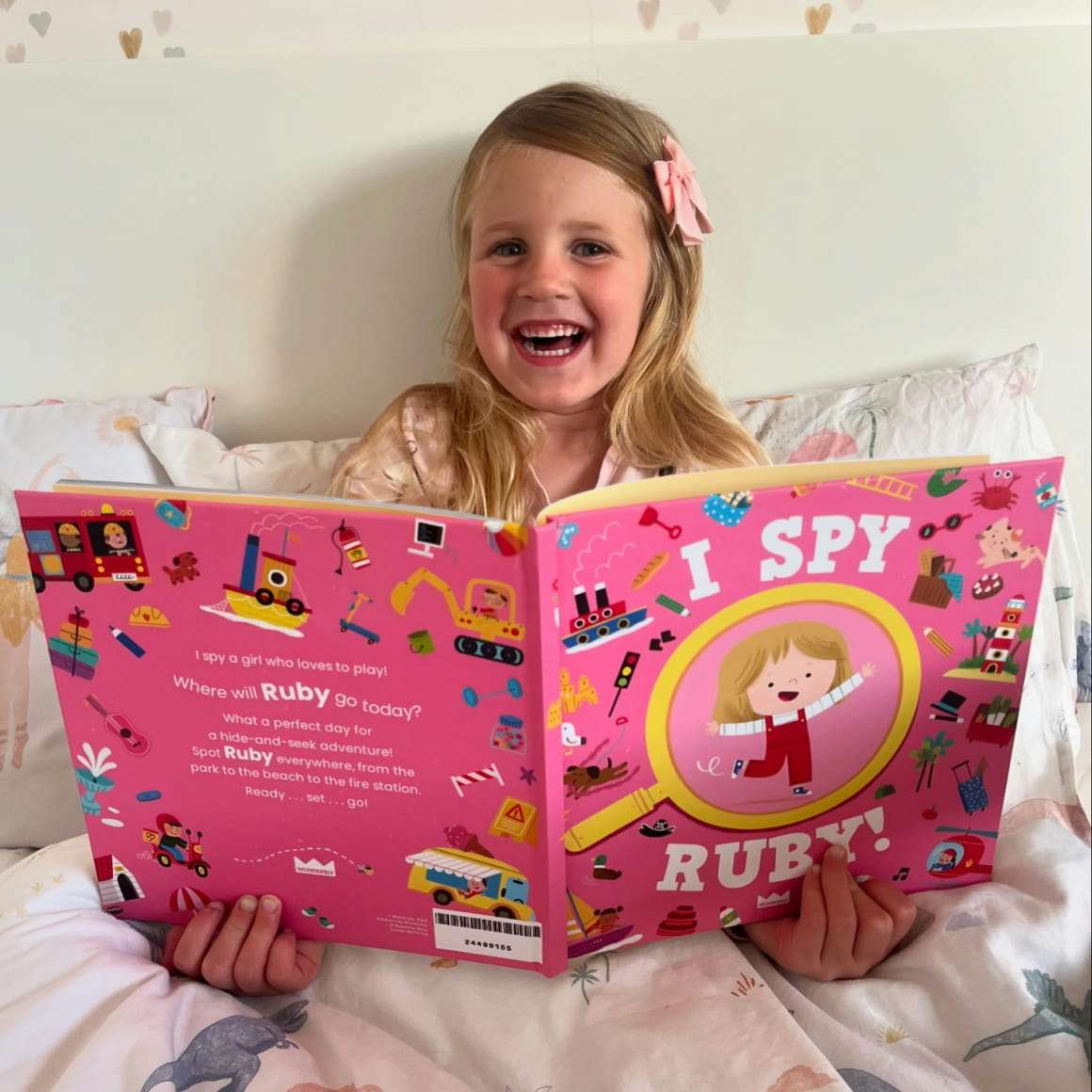 Child holding their personalised book