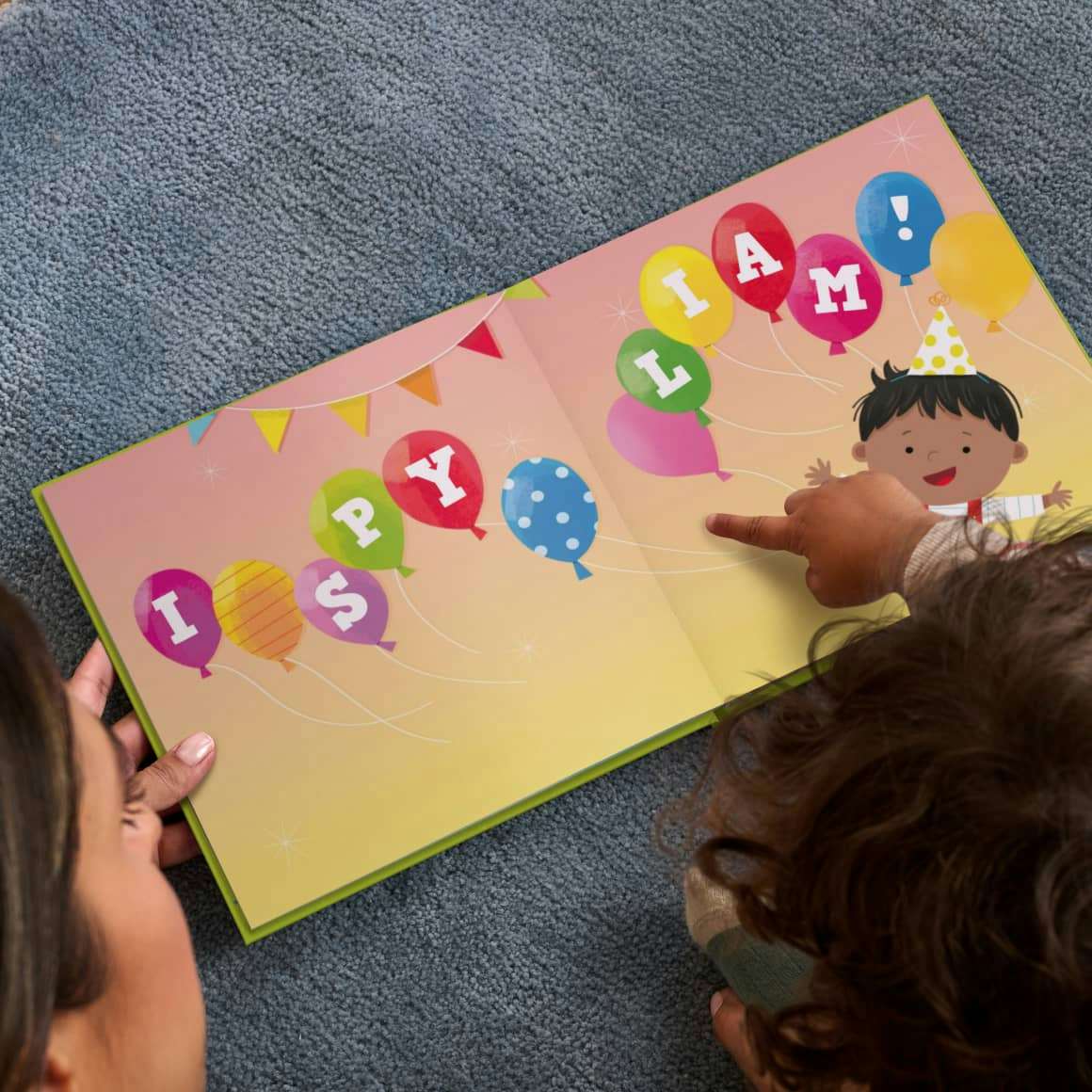 Child pointing to their personalised book