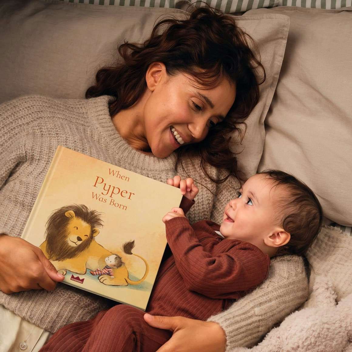 A child and mother holding a personalised book