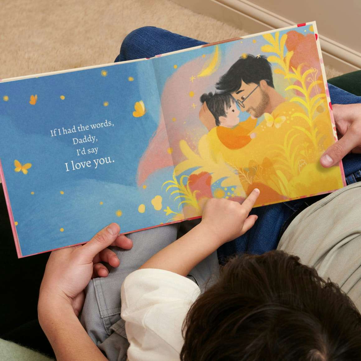 A child and father reading the personalised book