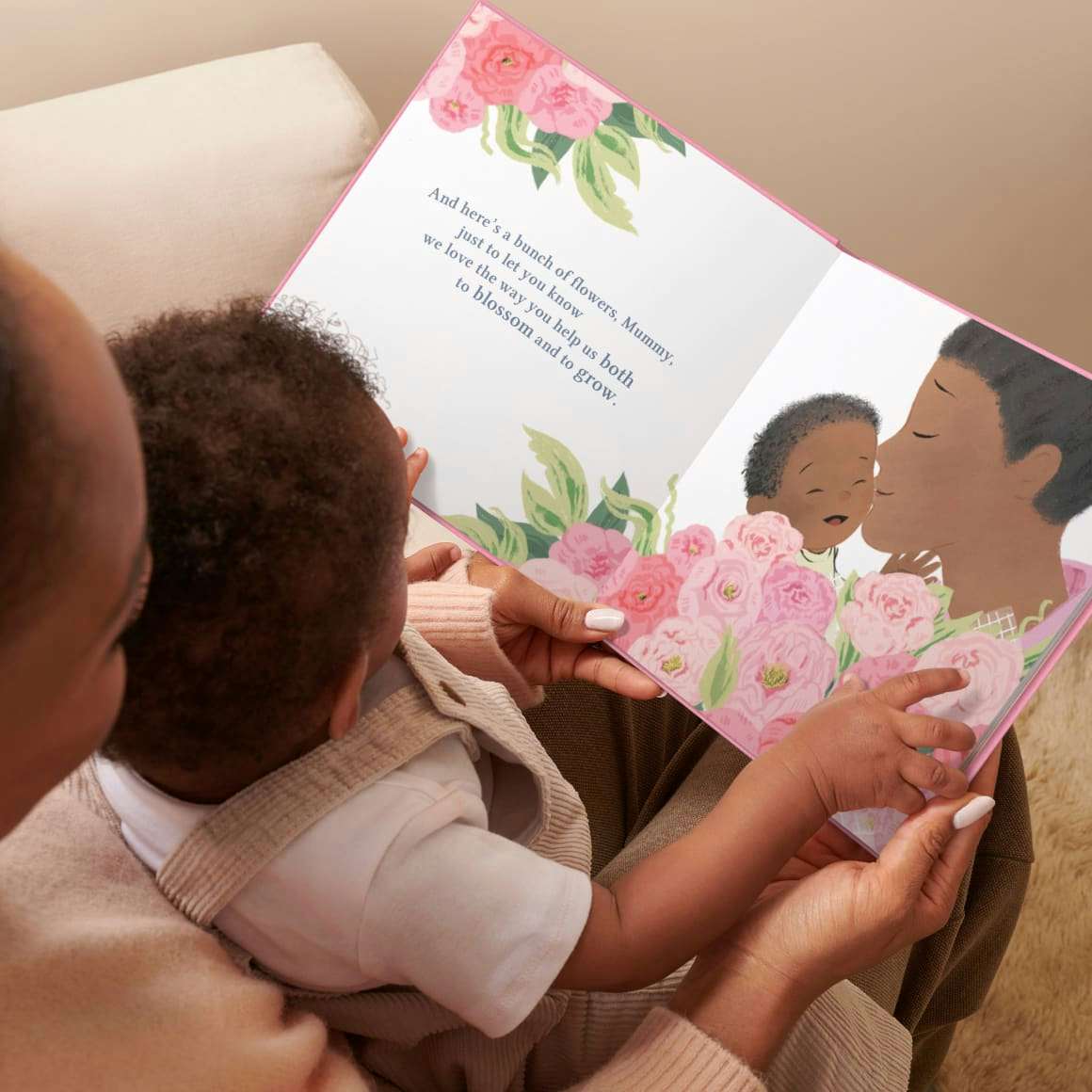 baby and mum reading book