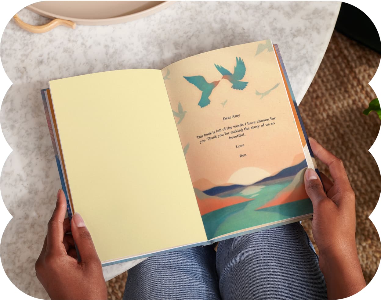 Two hands holding the open personalised book