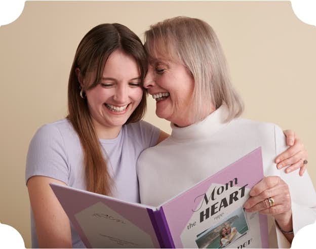 mum and her daughter holding a Mother's Day book