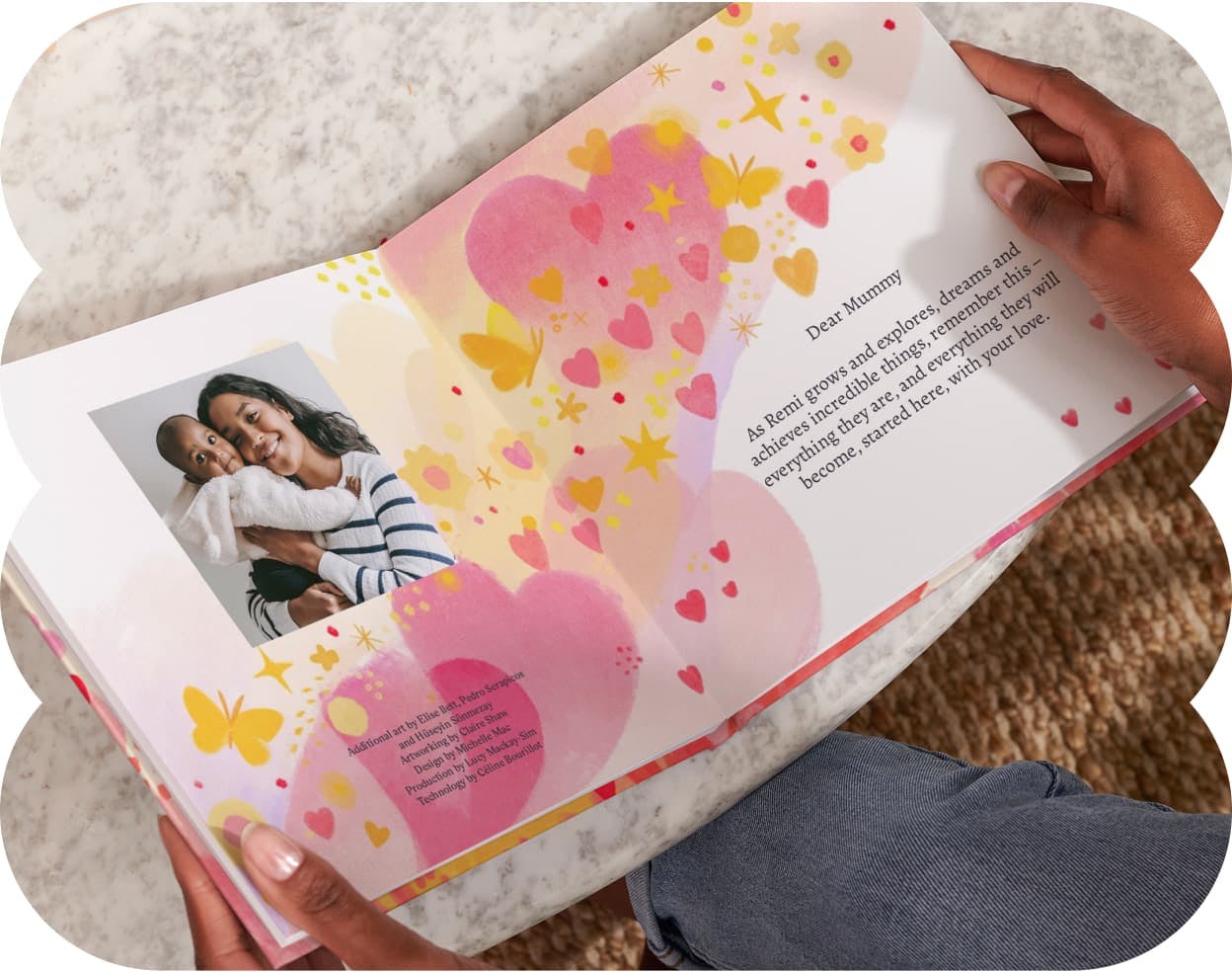 Two hands holding the open personalised book