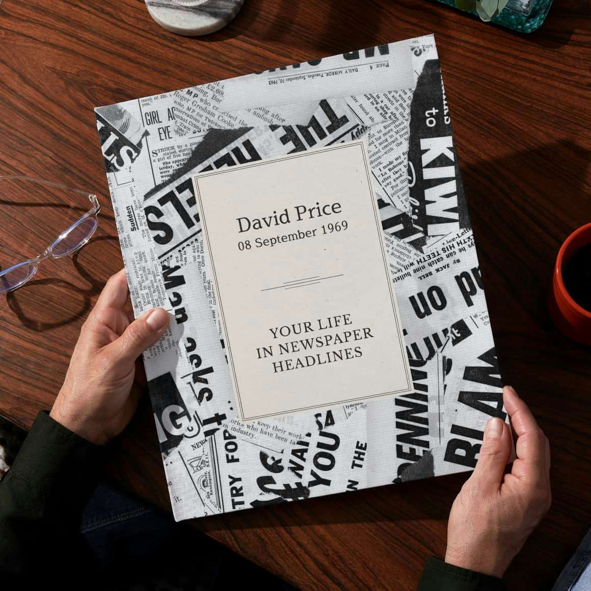 Two hands holding the personalised book