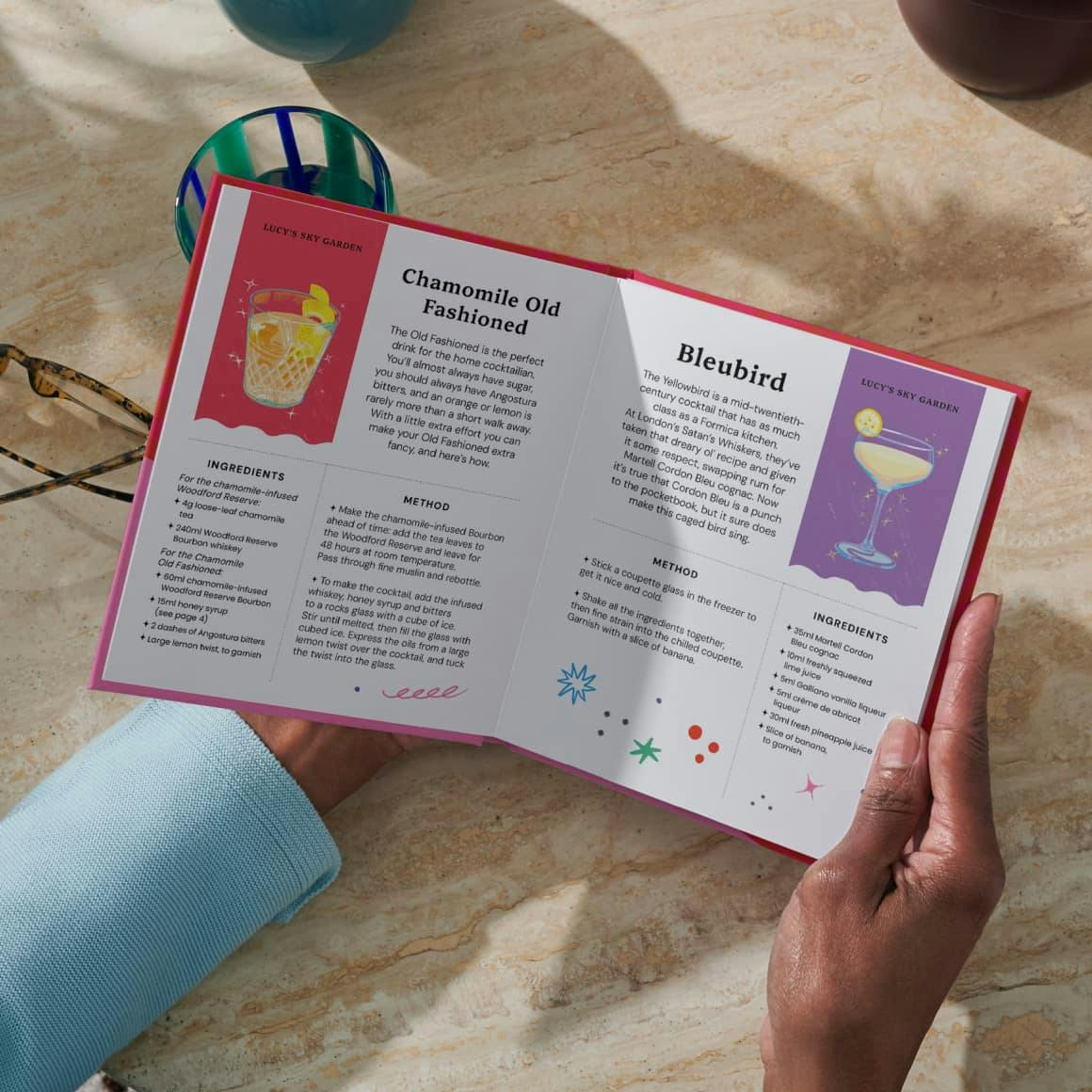 Two hands holding the open personalised book