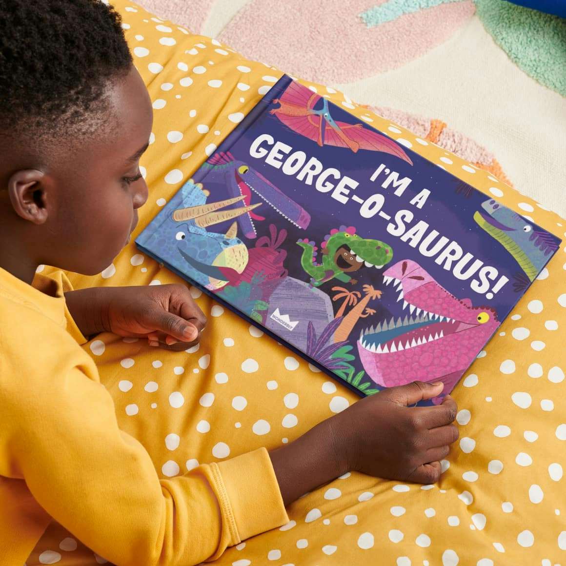 kid reading book on the bed