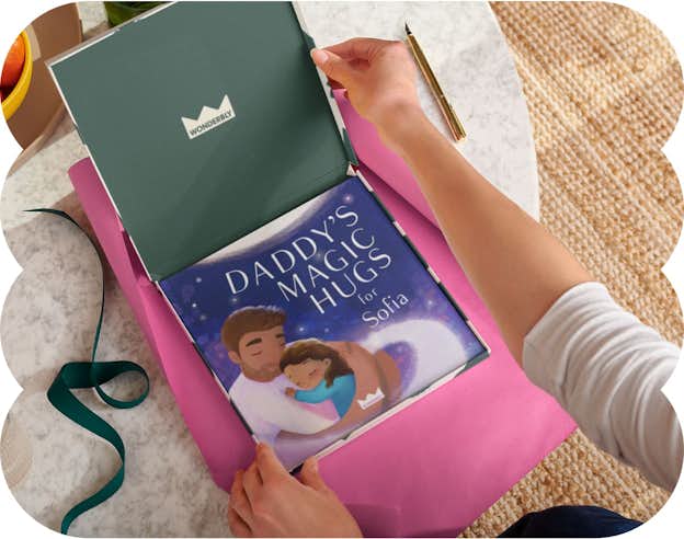 Two hands wrapping the personalised book