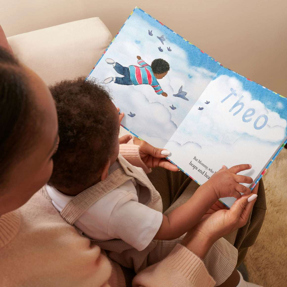 Mum and baby reading book together