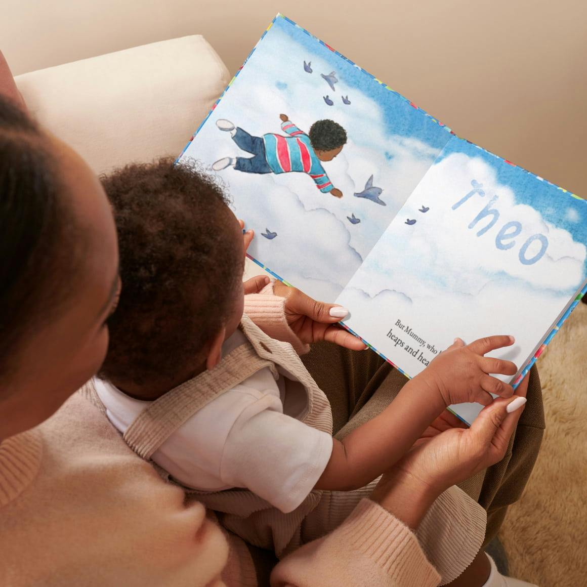 Mum and baby reading book together