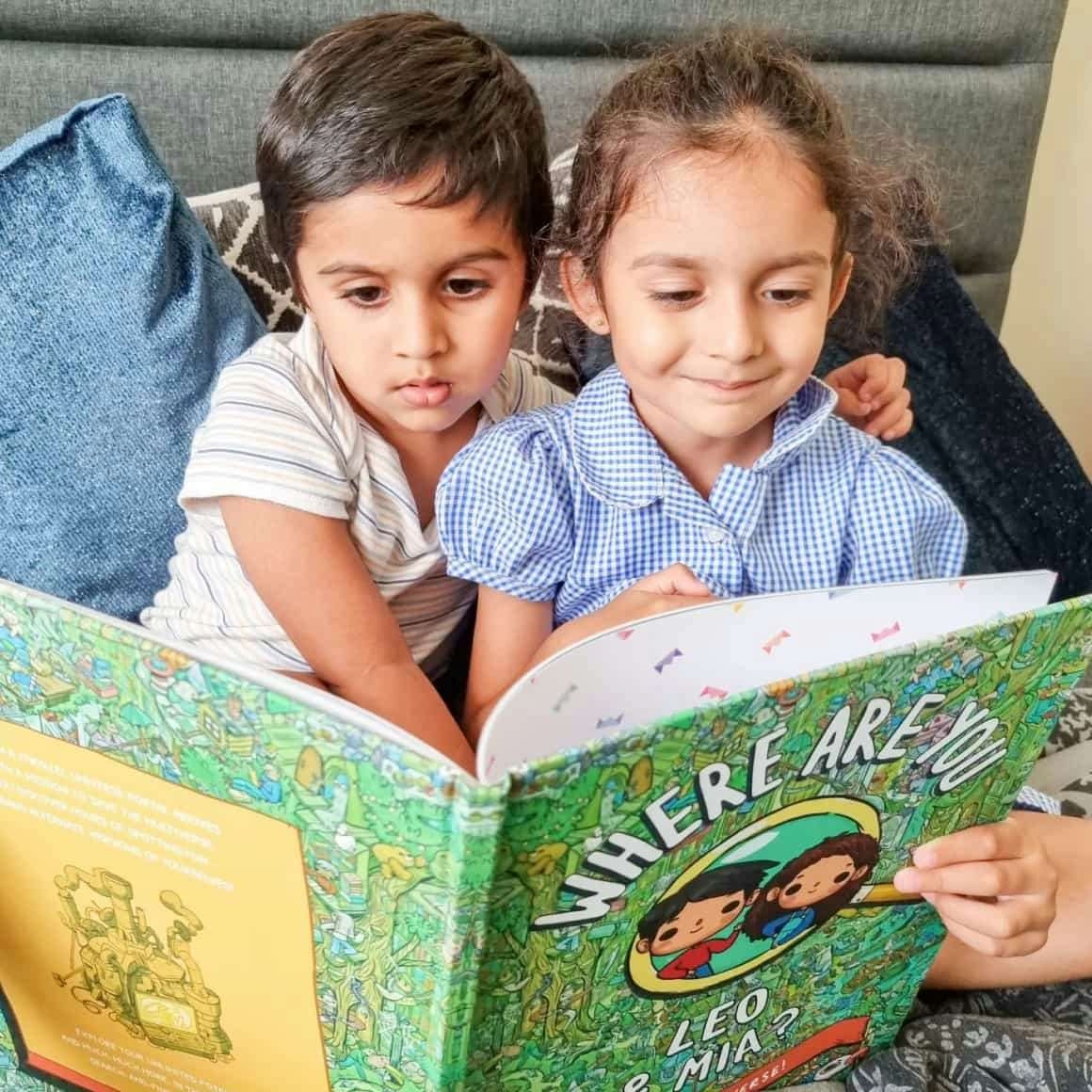 two kids reading the book