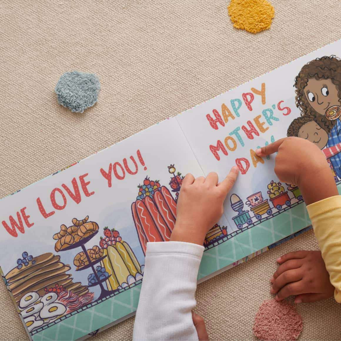 Children pointing to a page their personalised book