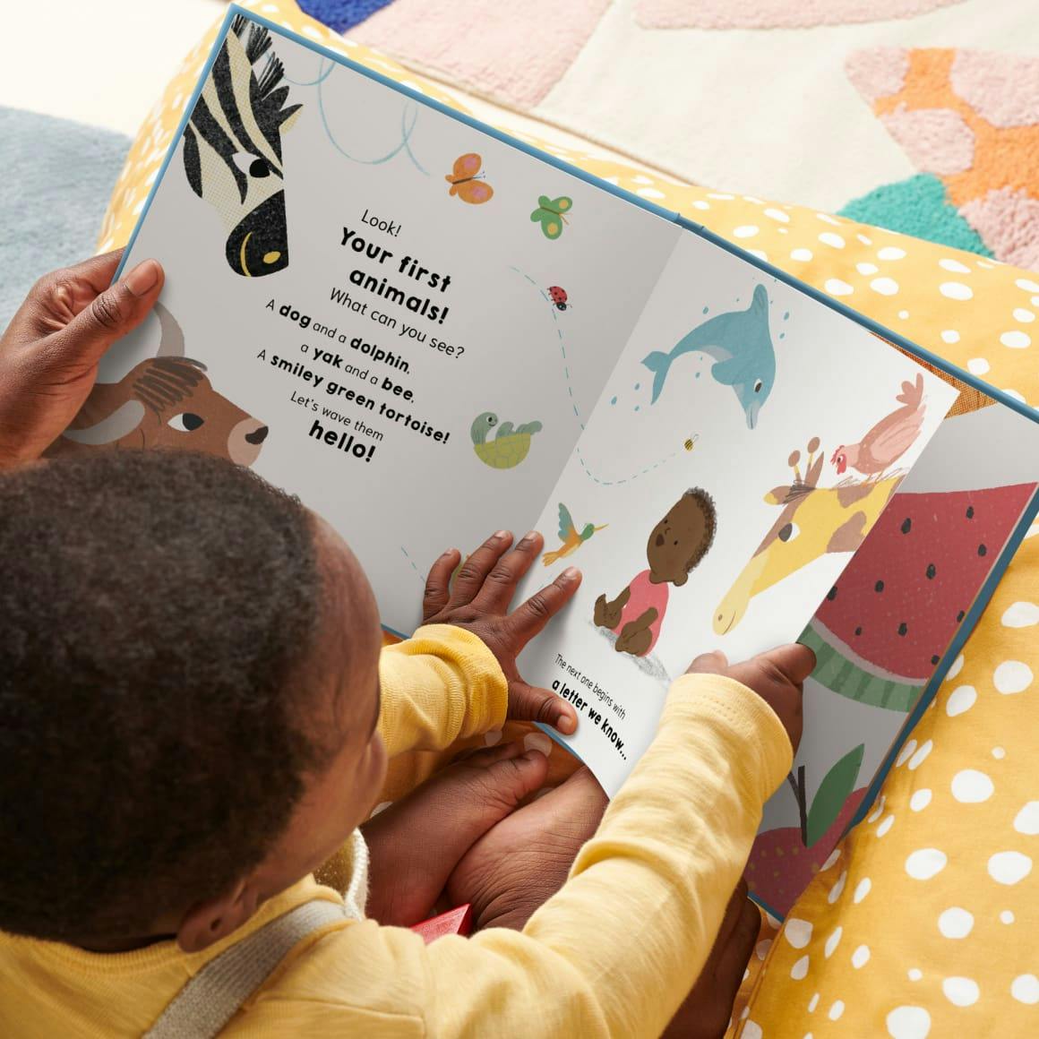 A child and mother reading the personalised book