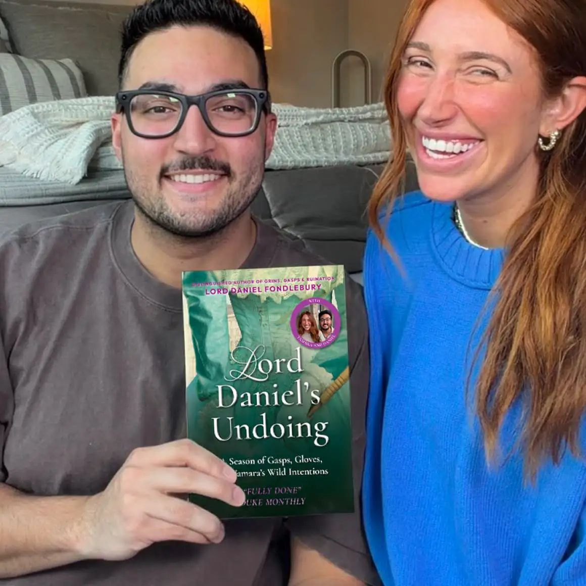 man and women holding the book