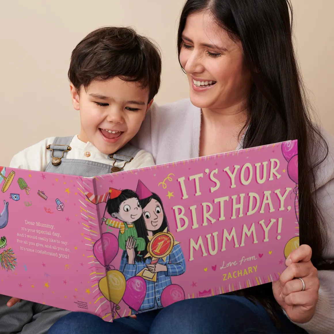 A mother and son reading their personalised book
