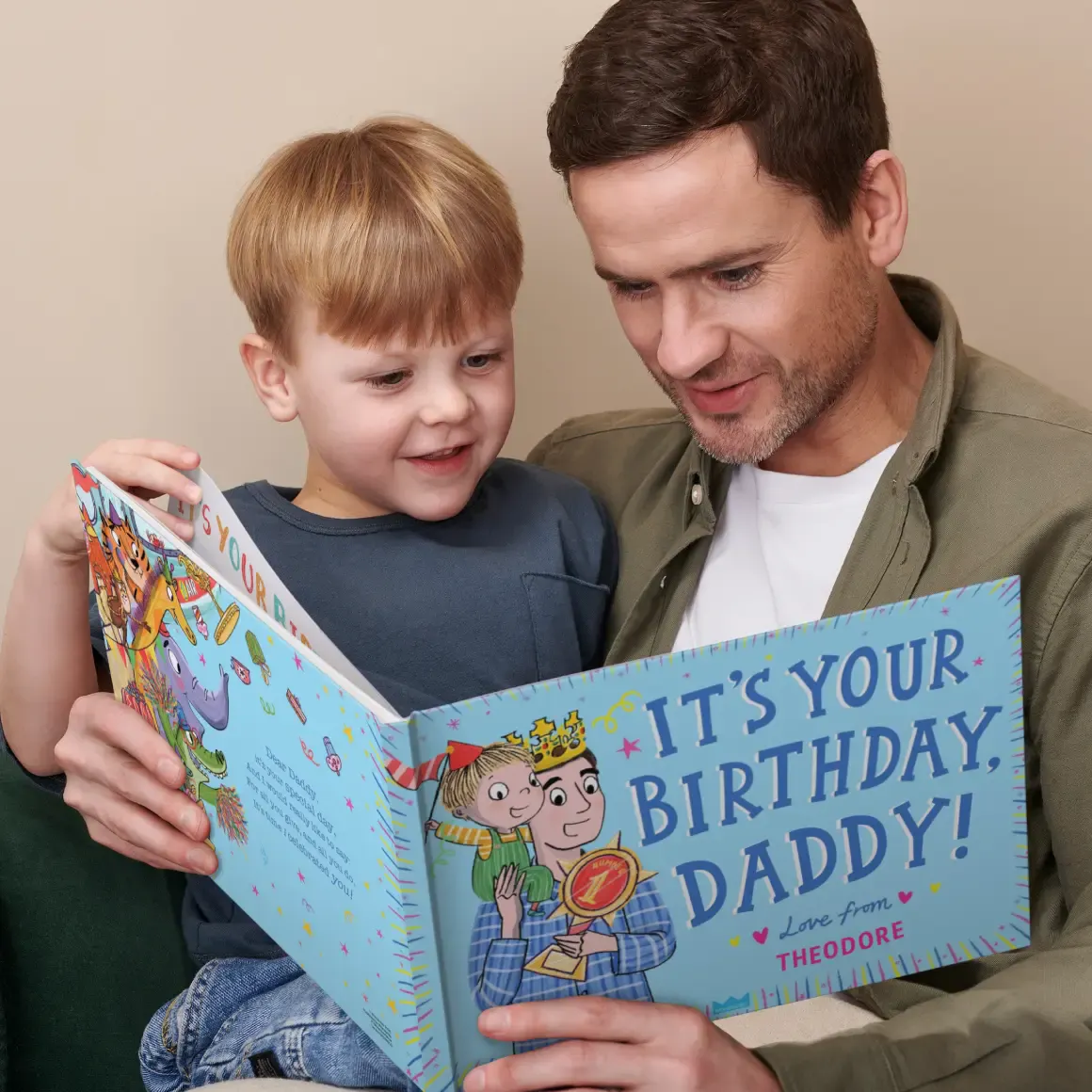 A father and son reading their personalised book