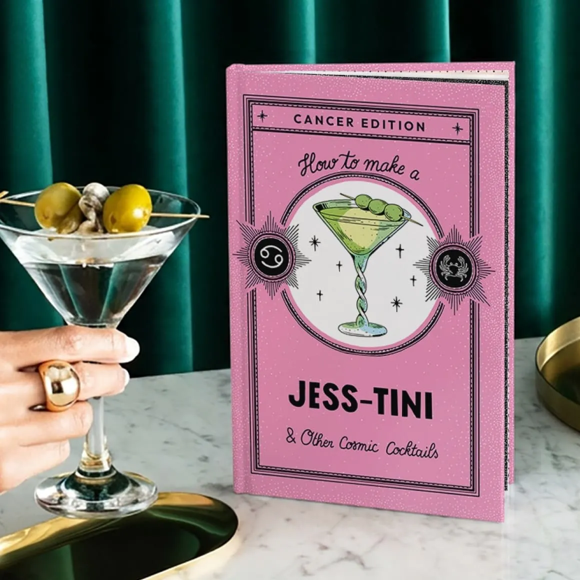 book on a table with a martini