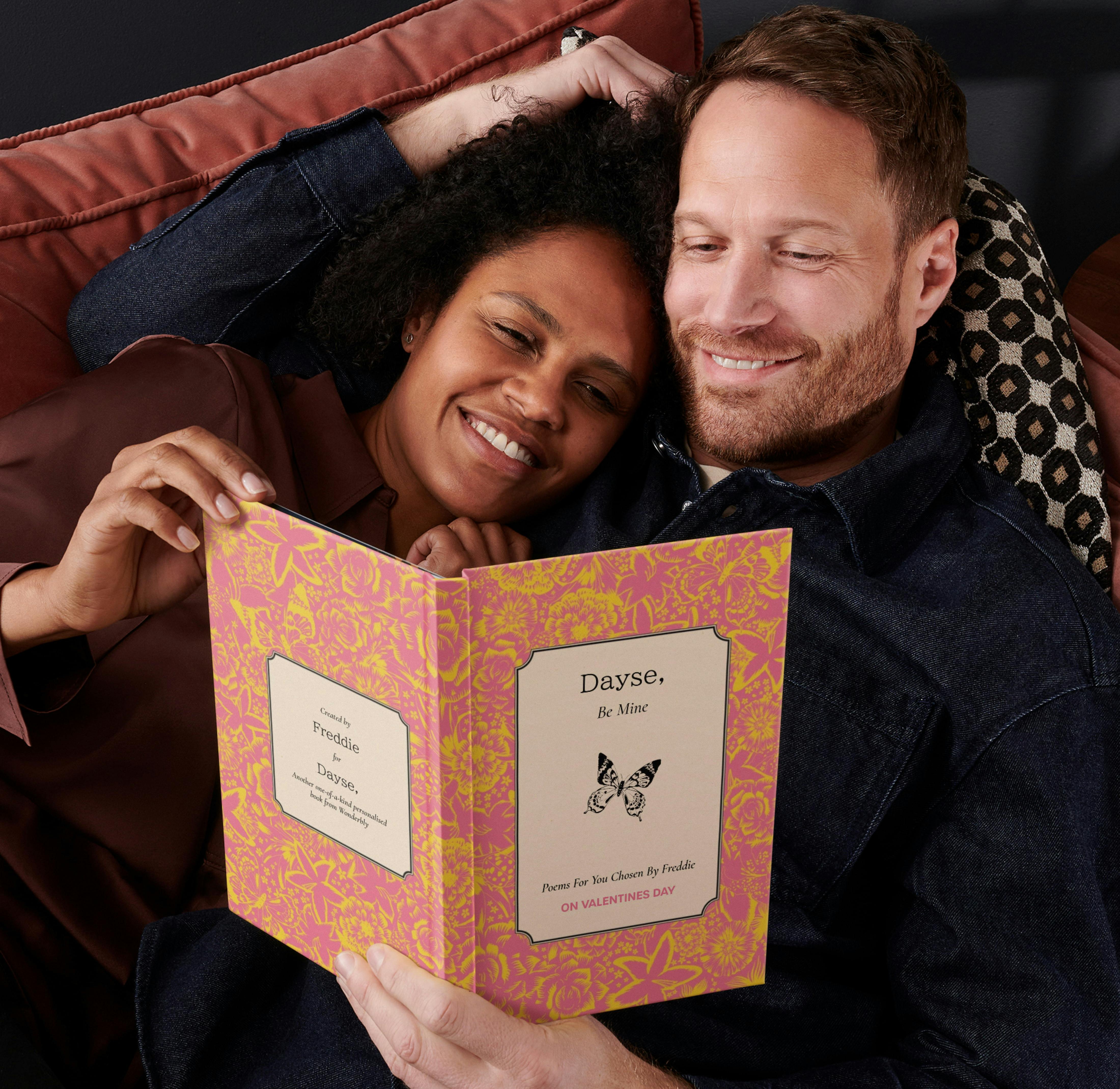 Couple reading personalised book