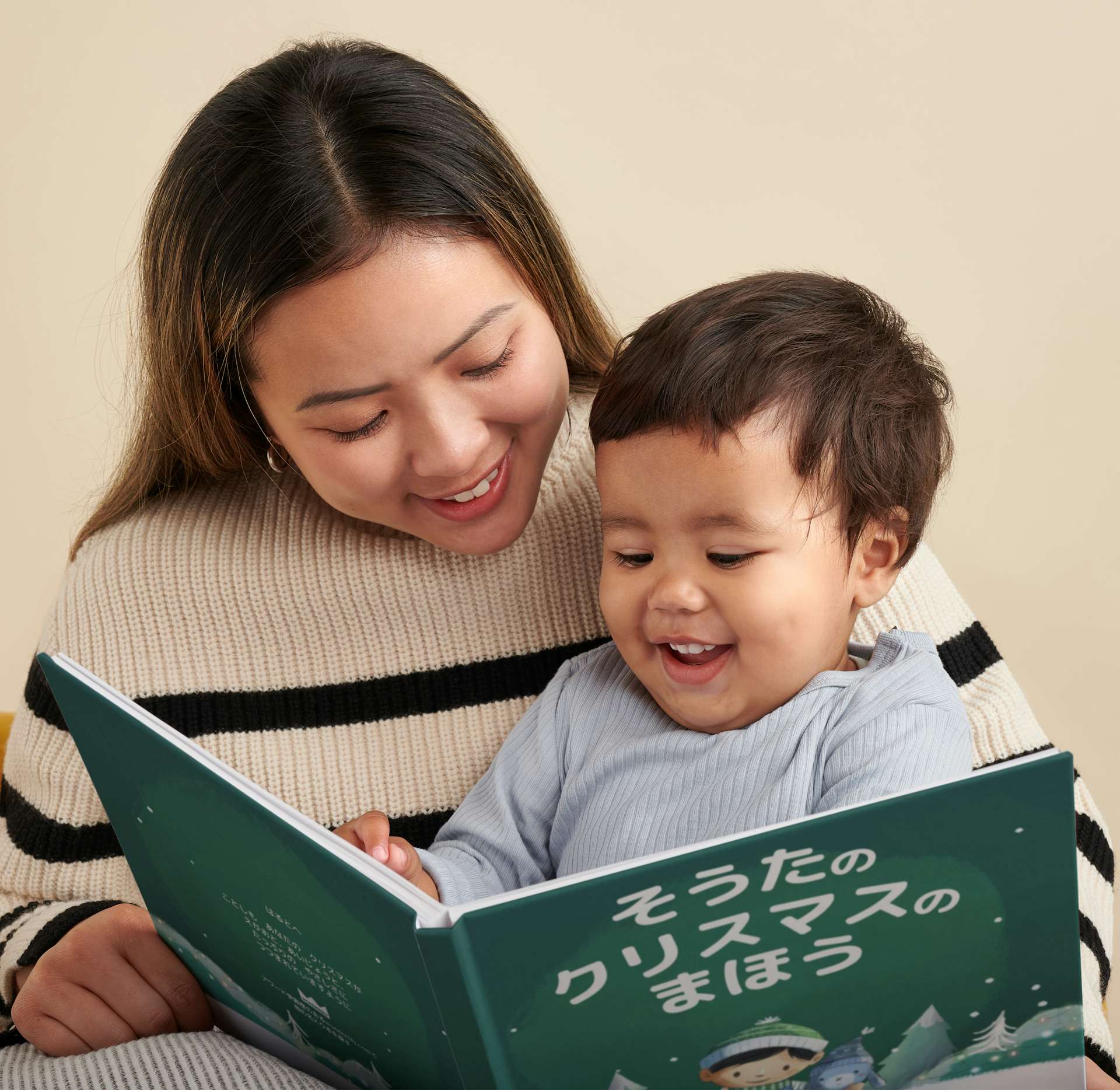child and mother reading christmas kindness for you book