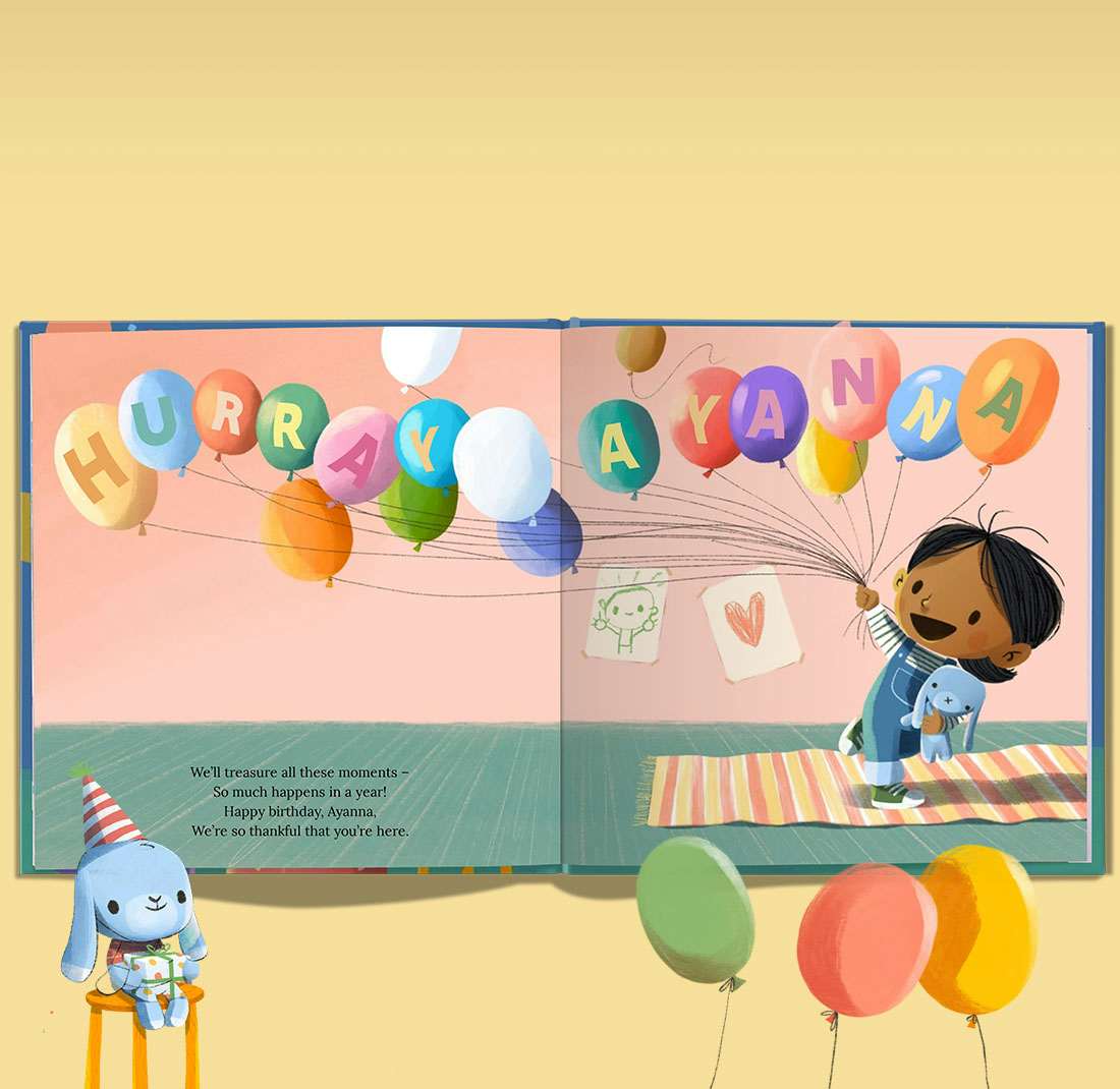 personalised spread of book with name in balloons