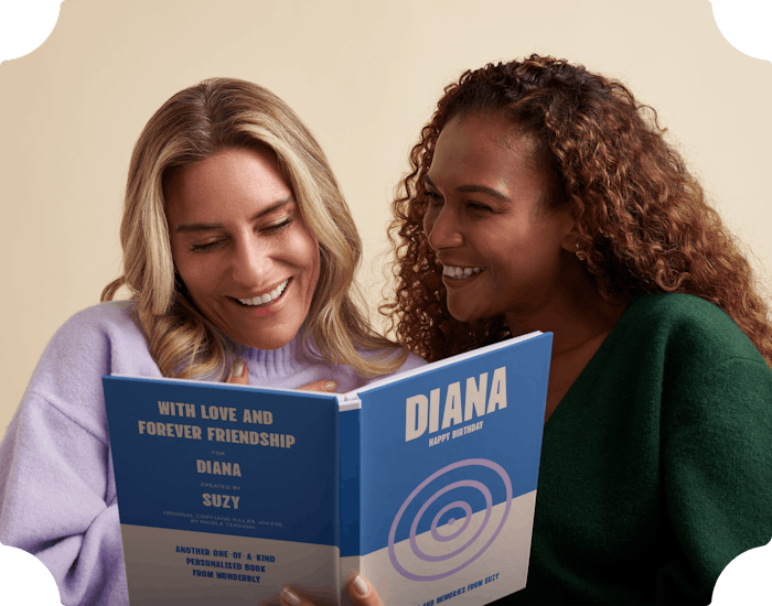 Two women reading their friendship book together