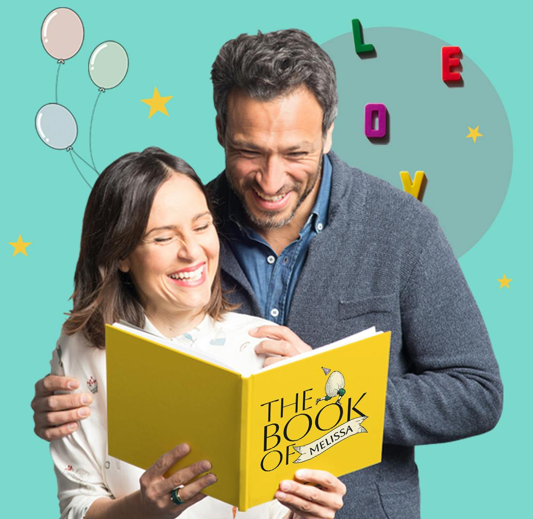 Two people reading The Book of Everyone Birthday