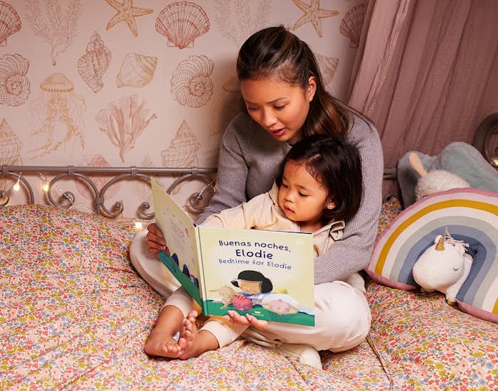 Mother and daughter reading the personalised book
