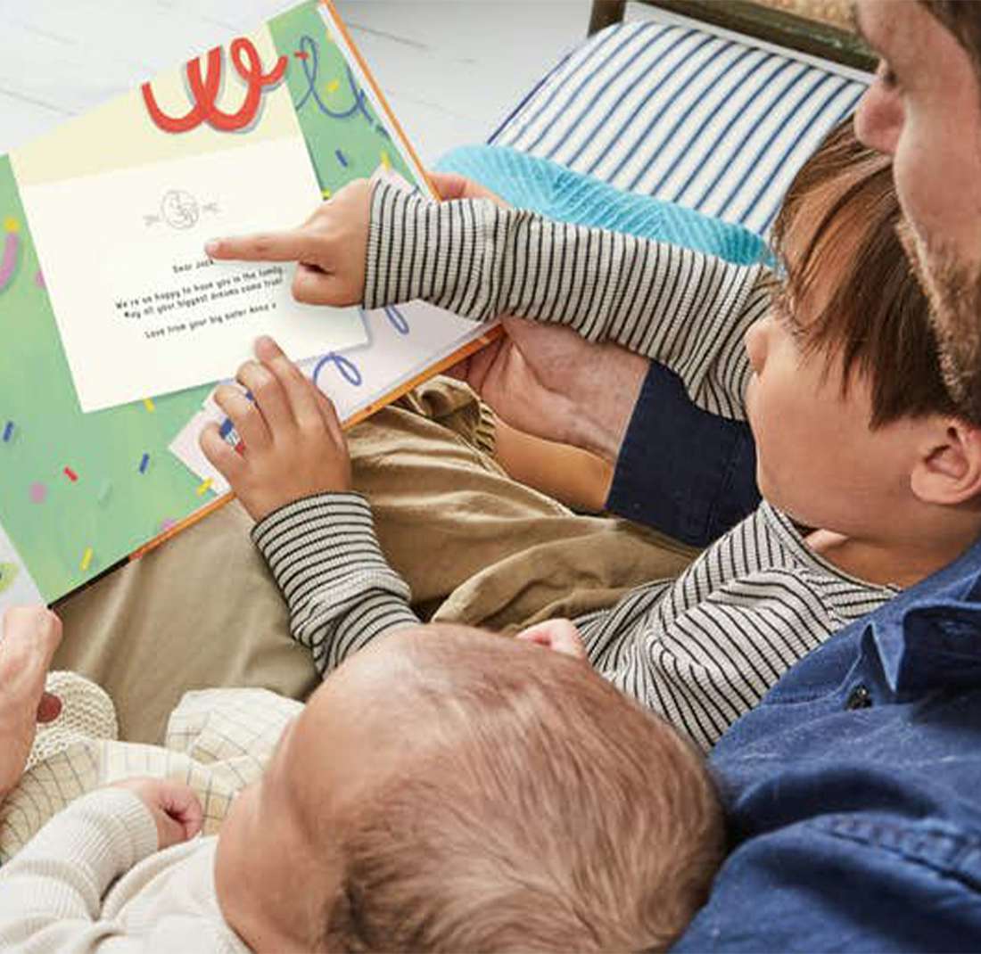 Family reading A Letter for the Littlest Bear