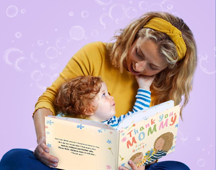 Mother and child reading Thank You, Mommy together