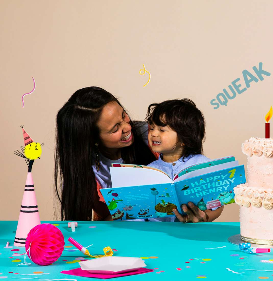 Mother and son reading Happy Birthday To You together