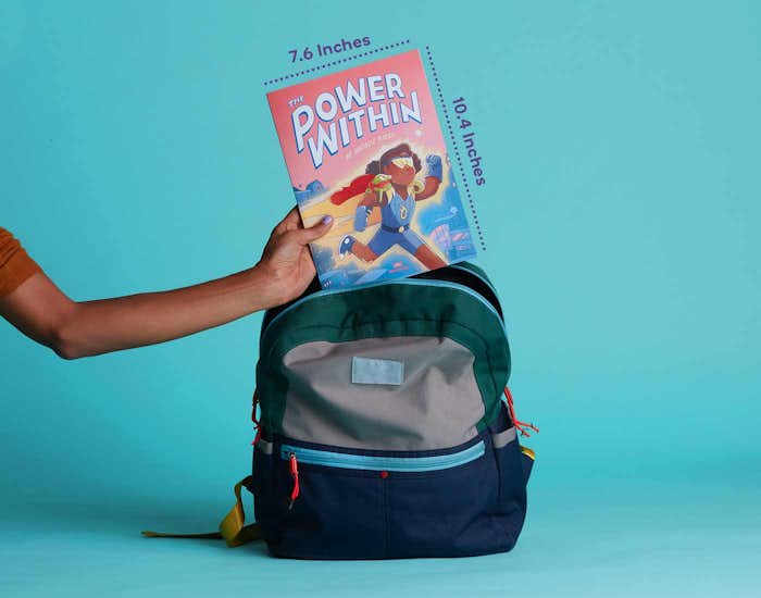The Power Within personalized book size 7.6 inches by 10.4 inches being placed in backpack