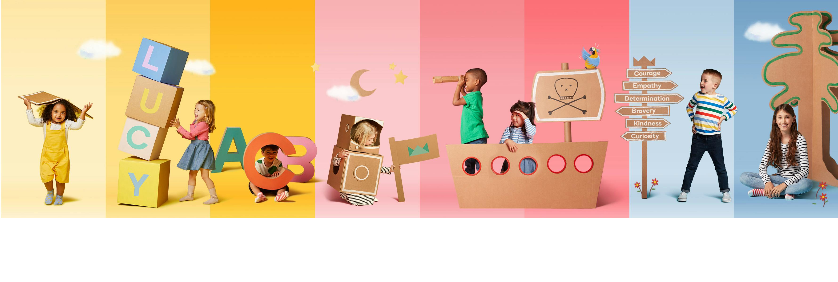 Children with cardboard books and letters