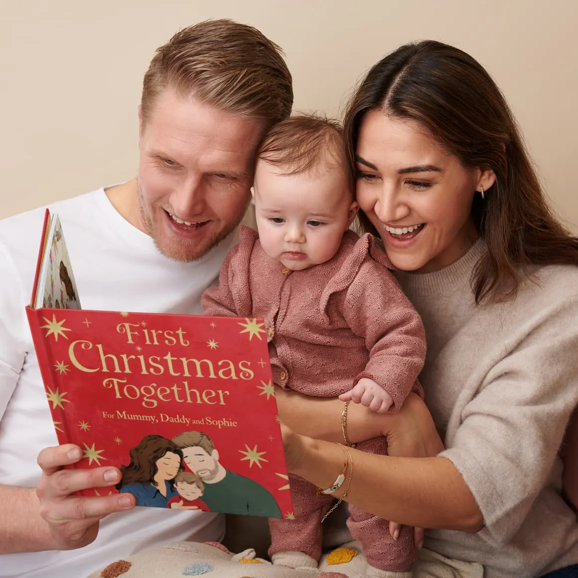 A child and their parents reading the personalised book