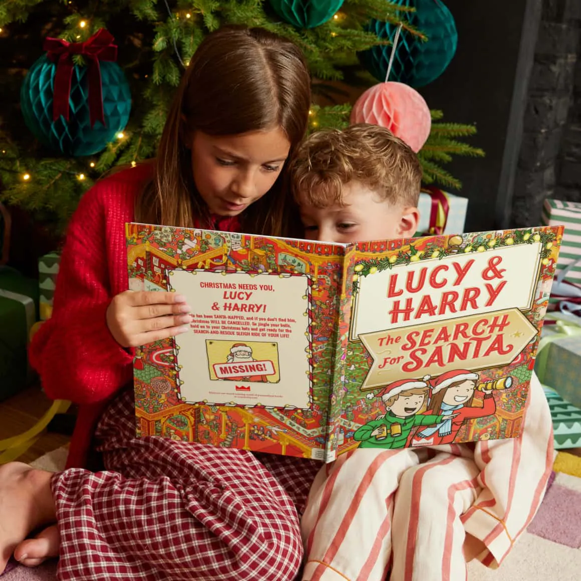 kids reading book by the tree
