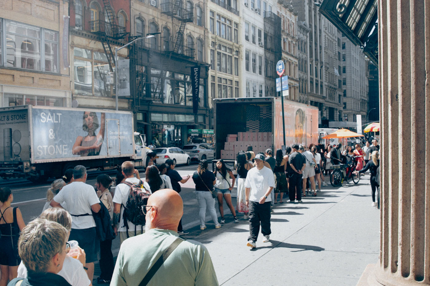 people lined up outside a storefront for a limited-edition drop