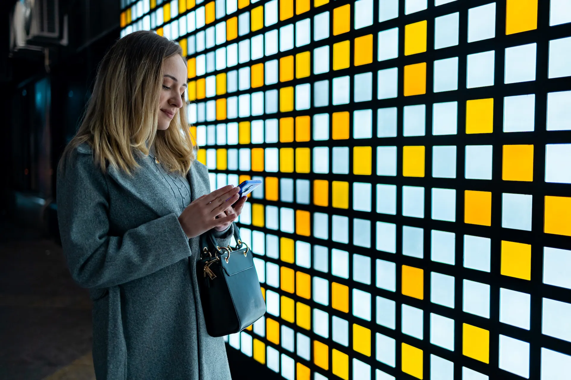 A visitor on an event looking at her smartphone