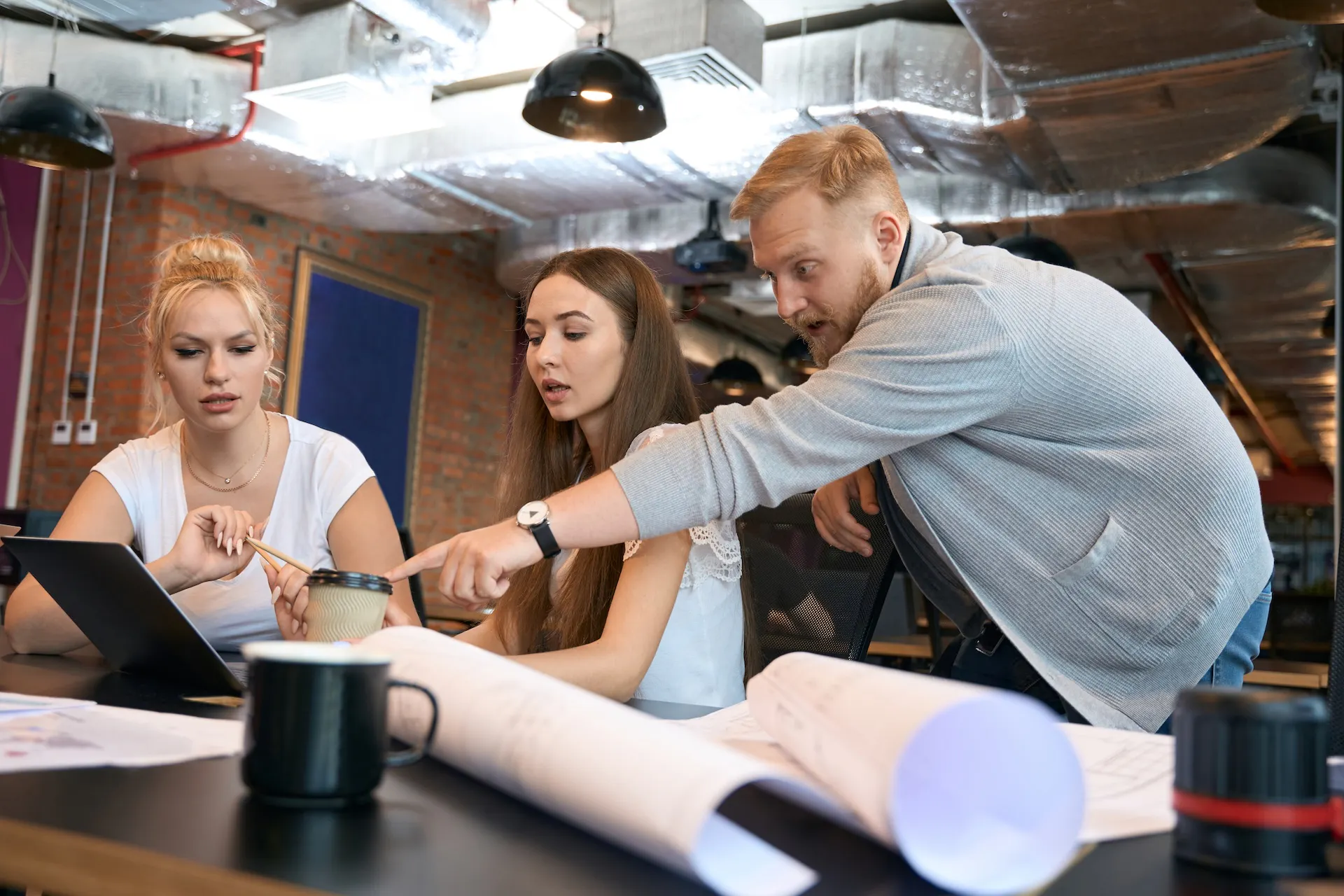 a project manager reviewing plans or timelines with vendors during install