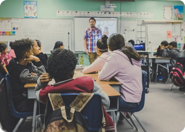 students and teachers in a classroom