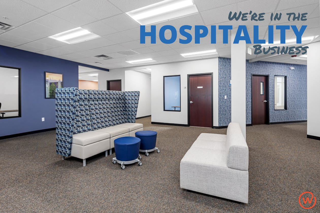 An image of the shared space at Workspace Beverly and the caption "We're in the Hospitality business."