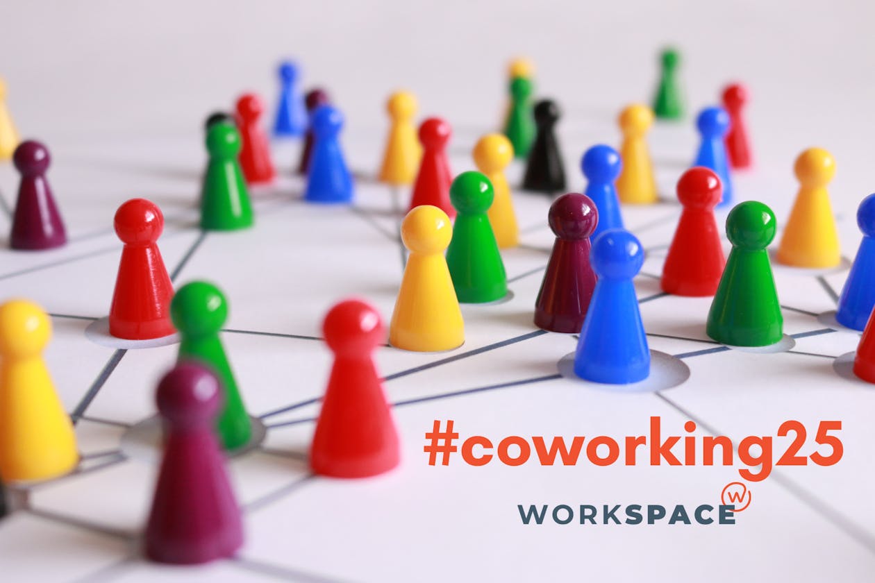 Different colored game pieces on a board with the hashtag coworking 25