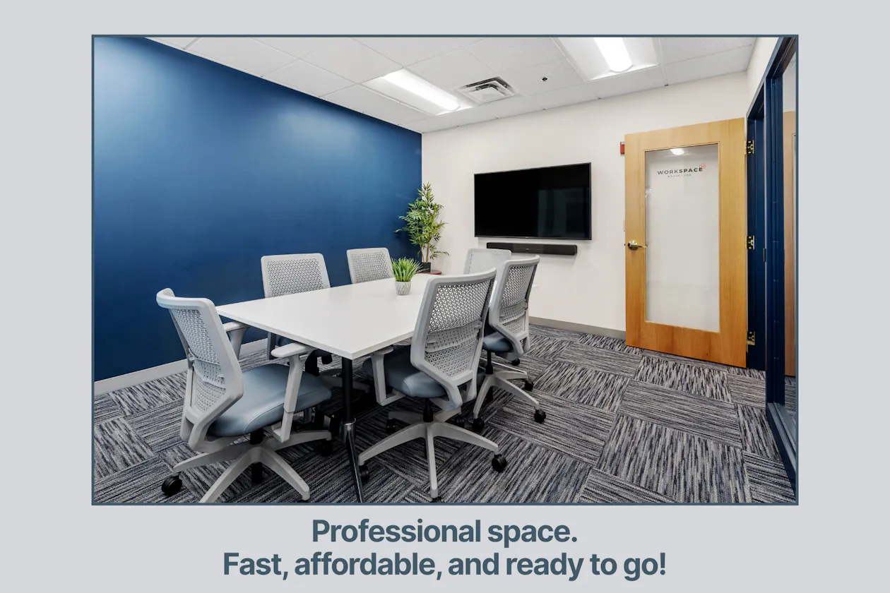 An image of the meeting room at Workspace Braintree. There is a conference table with 6 chairs and a flat screen tv on the wall.