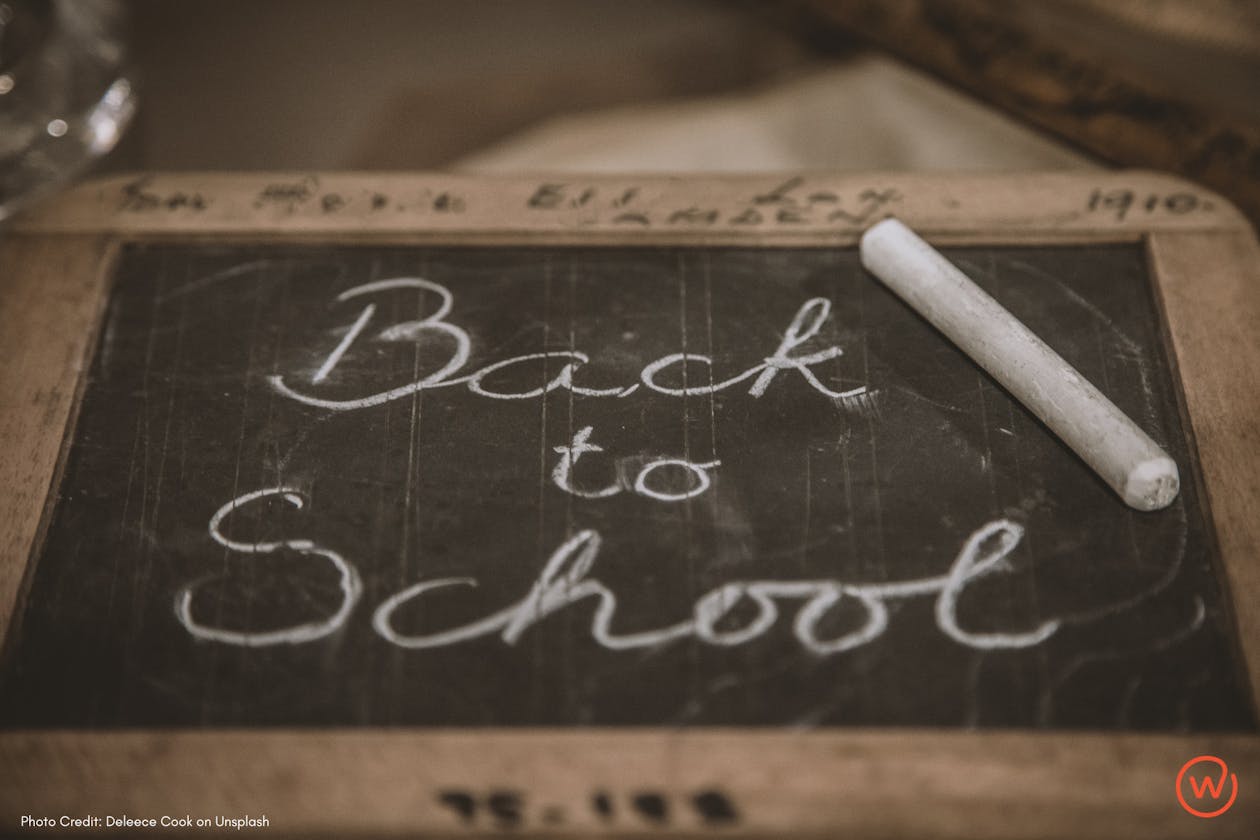 Chalk board with "Back to School" written on it.