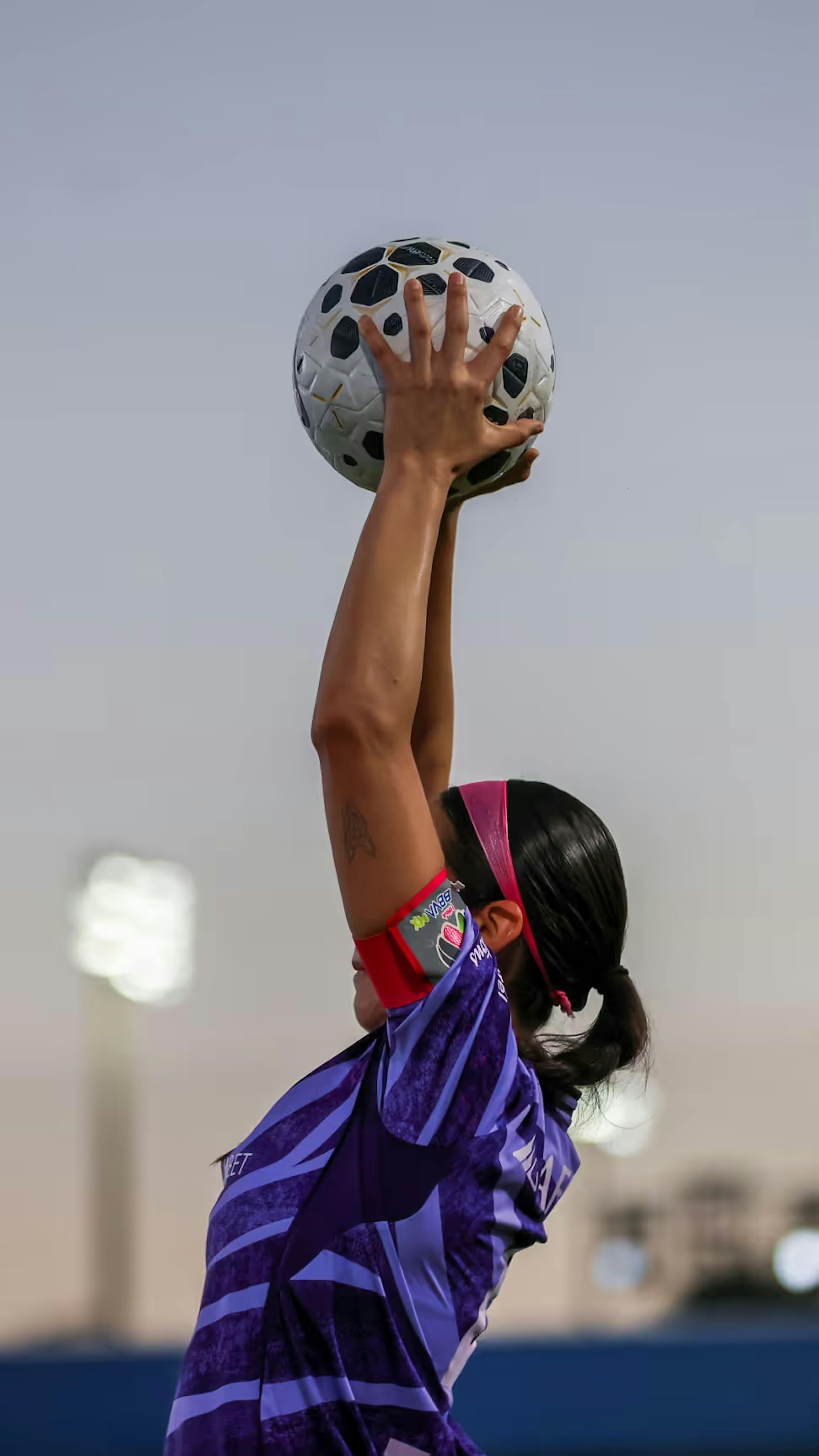 Tigres player taking a throw in during world sevens football night match