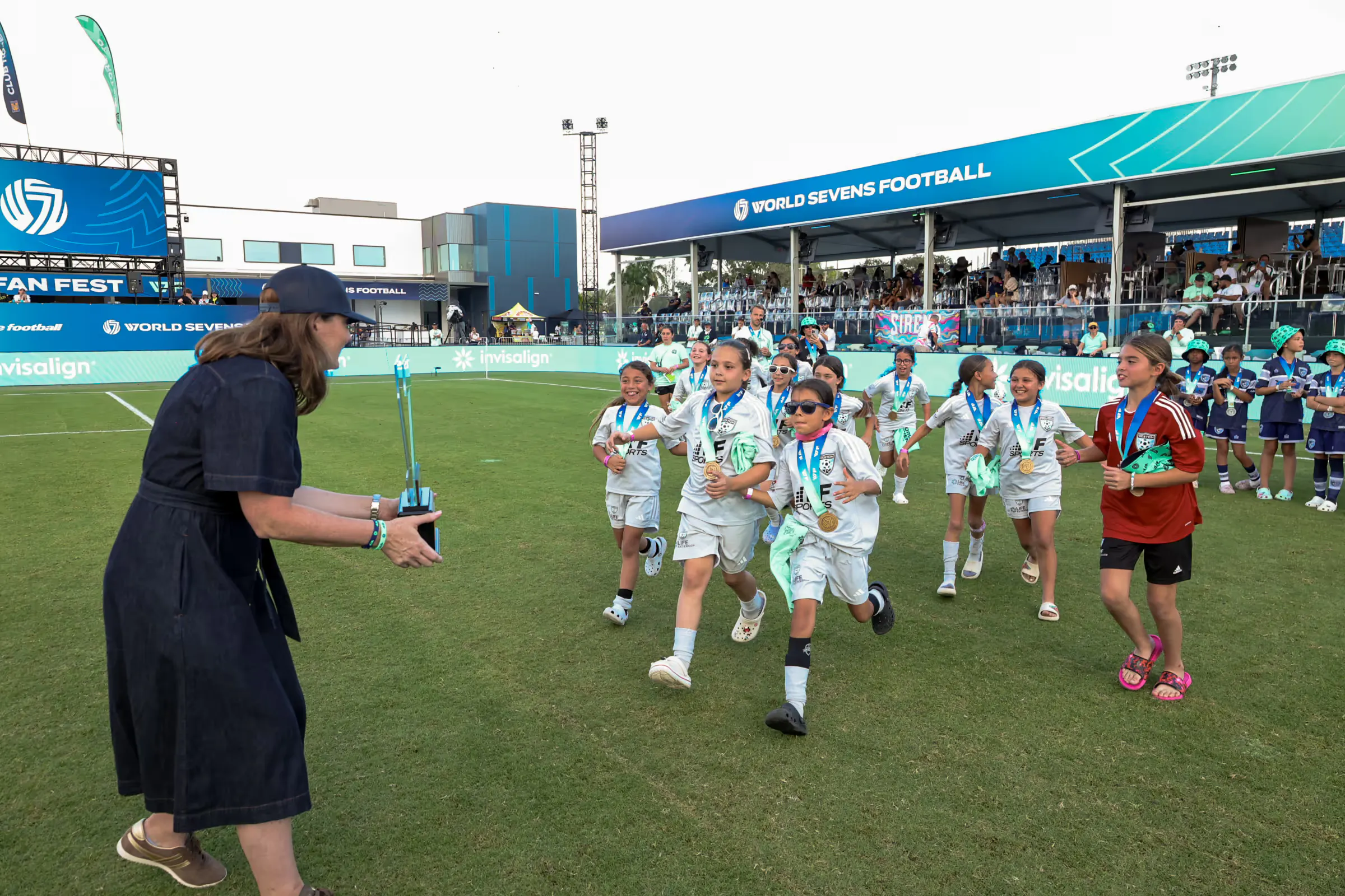 Youth soccer team being presented the trophy at Rising 7s tournament