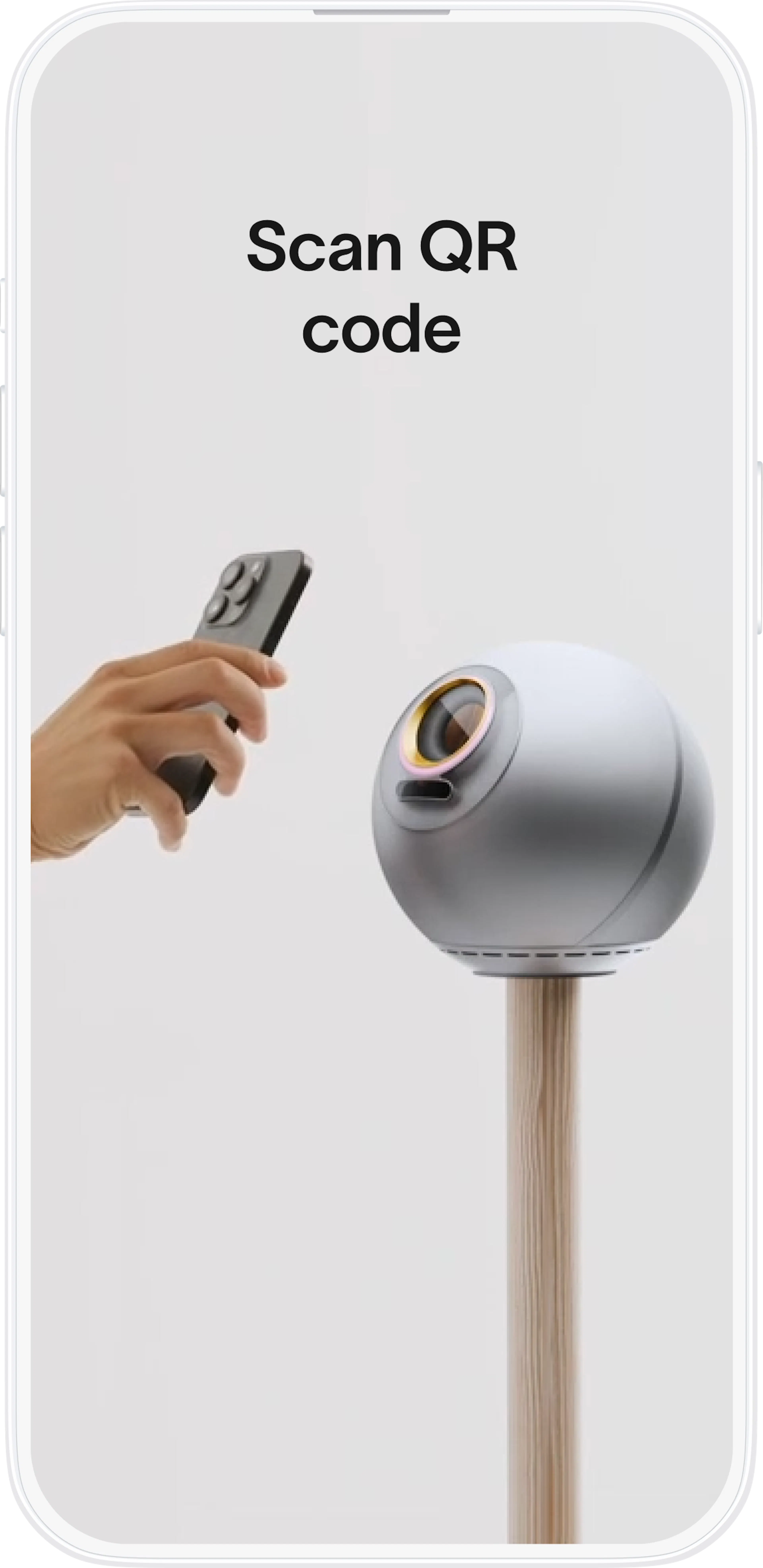 A hand holding a remote control points to a QR code on an Orb device on a wooden stand, promoting the verification process.