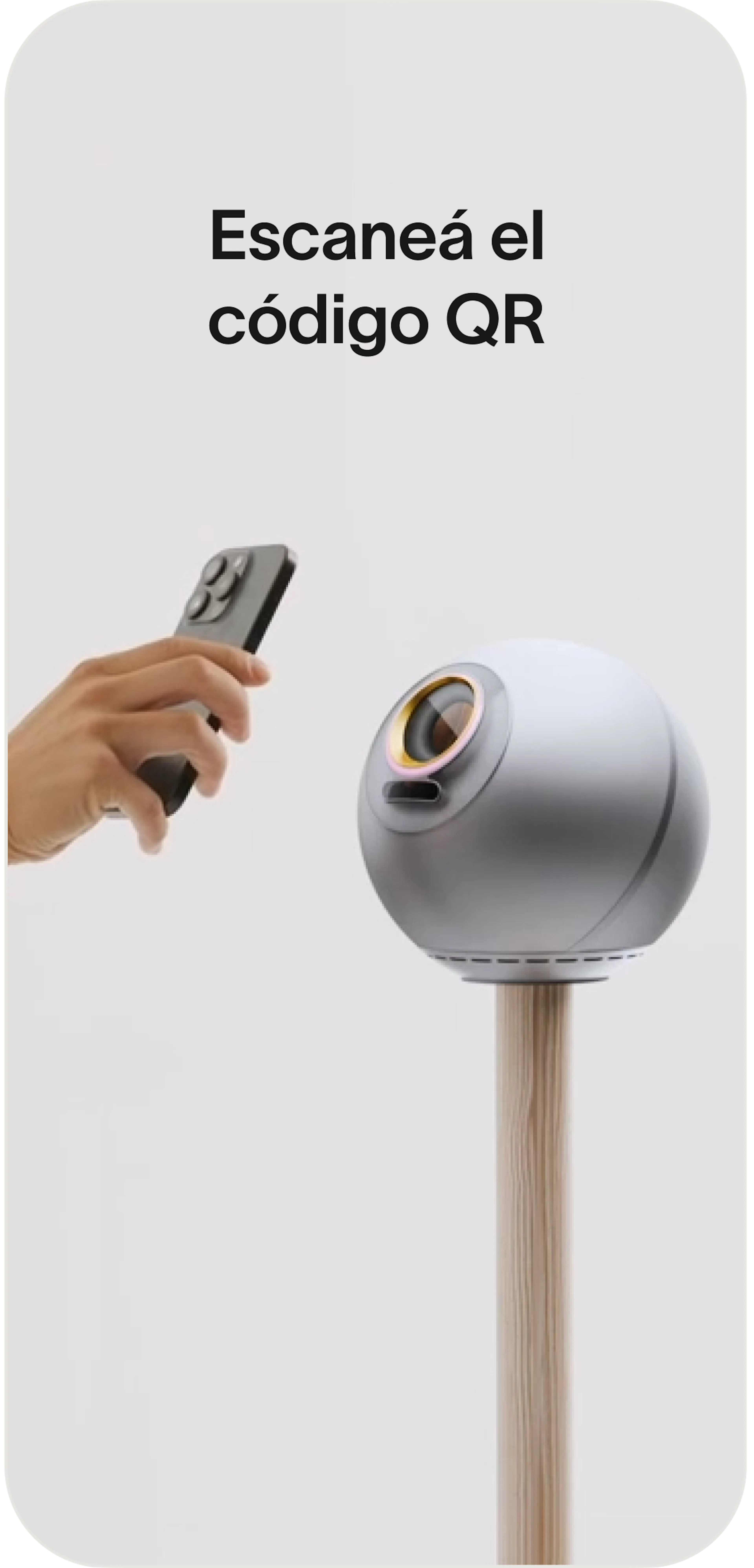 A hand holds a smartphone near an Orb for QR code scanning.